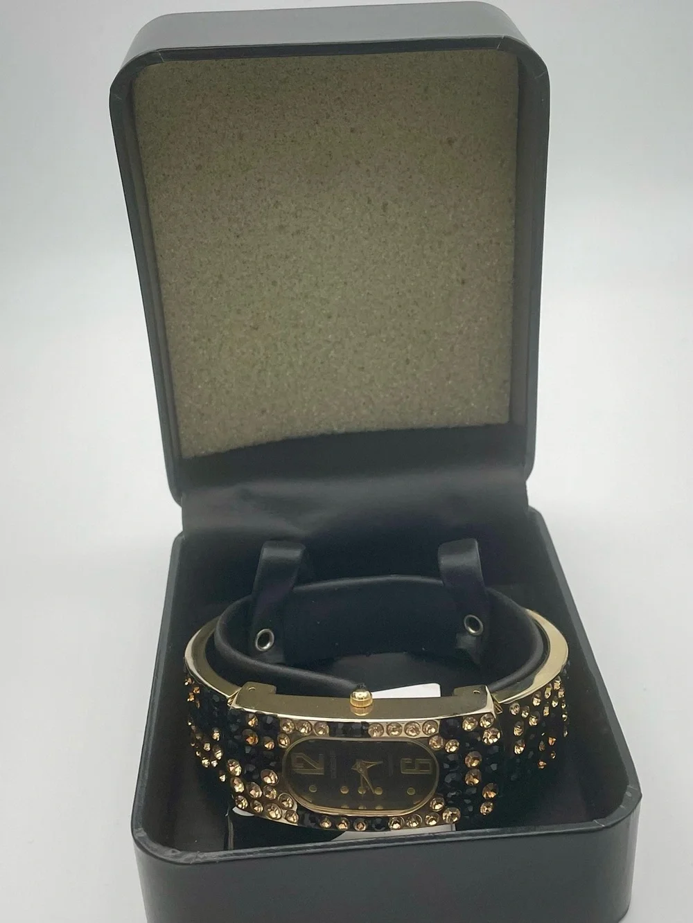 Gossip Gold-Tone Black and Champagne Crystal Bangle Watch. In original box.
